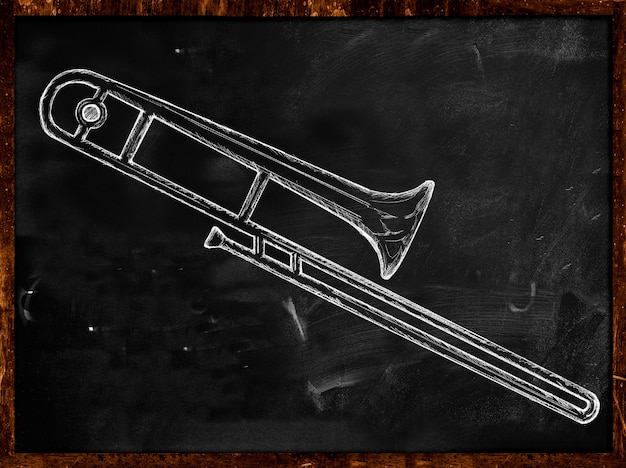 Free photo long trumpet sketch on blackboard