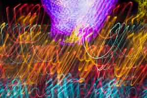 Free photo long yellow and cold colors exposure neon lights texture