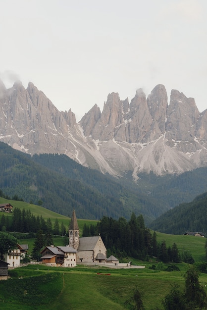 Free photo look from afar at a church somewhere in italian dolomites