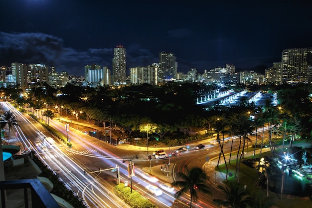 Look from above at highways crossing night city