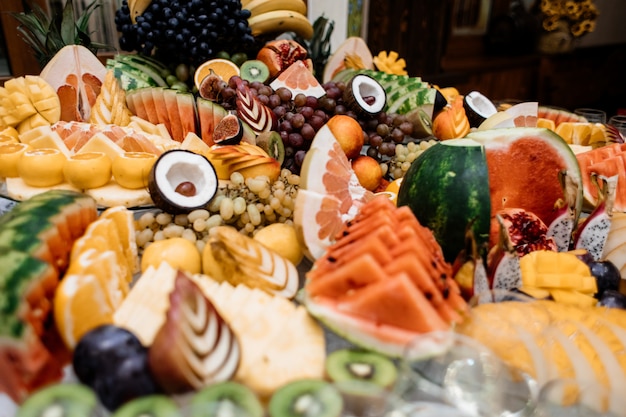 Lot of different fruits are on the catering table