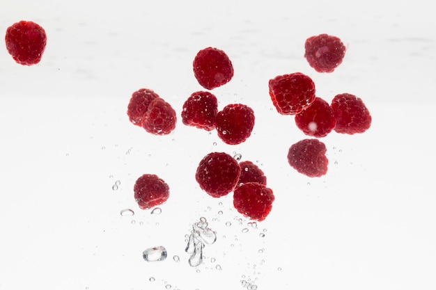 Free photo lots of raspberries in water