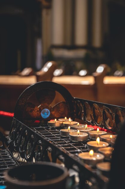 Lots of small candles in a catholic church