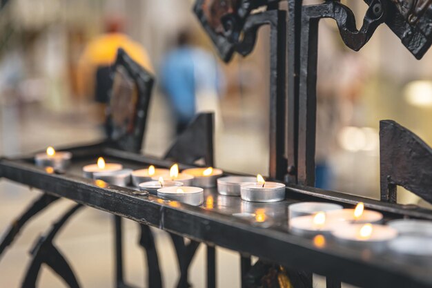 Lots of small candles in a catholic church