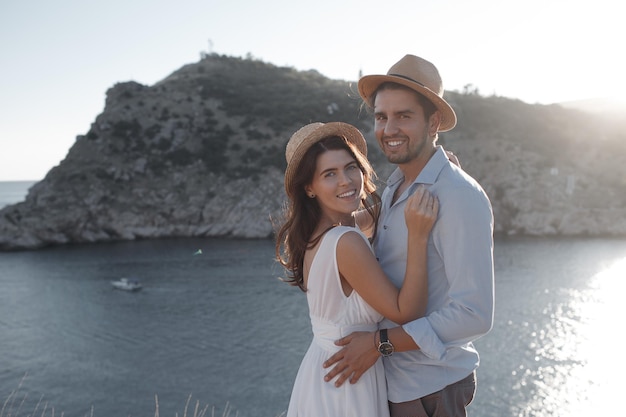 Free photo love couple of pretty woman and man in hats outdoor