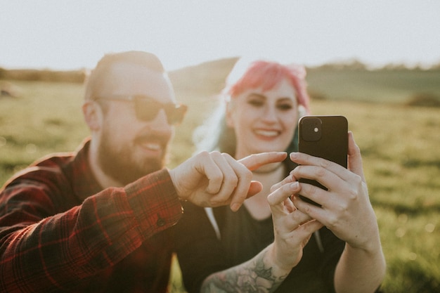 Free photo in love couple taking a selfie together