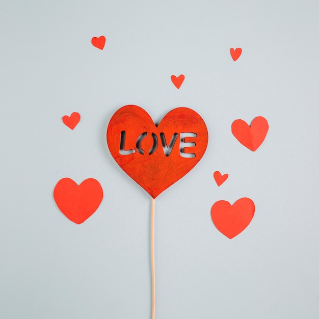 Free Photo love inscription on paper heart on wooden stick