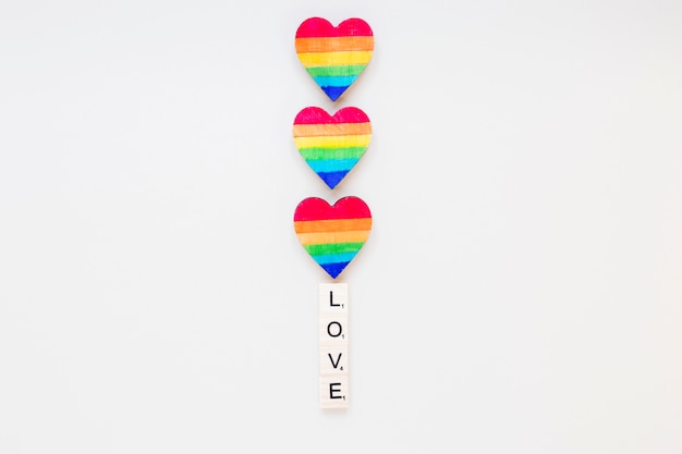 Free Photo love inscription with rainbow hearts