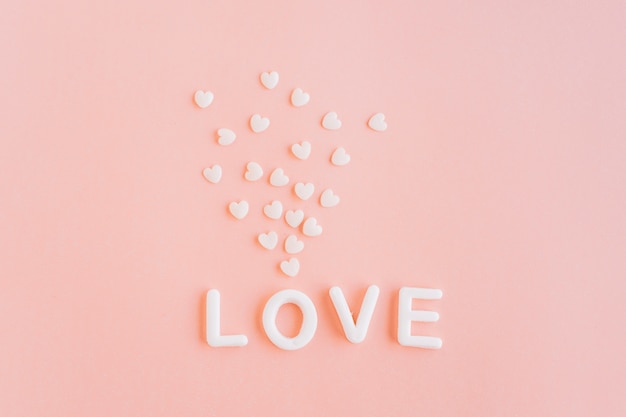 Love inscription with small hearts 