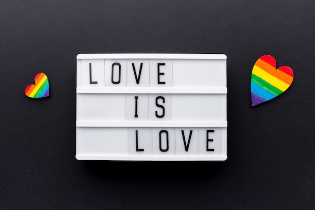 Free Photo love is love pride quote with colourful hearts