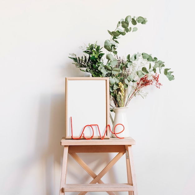 Love letters and frame on stool