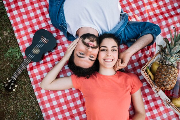 Love and picnic concept with top view of couple