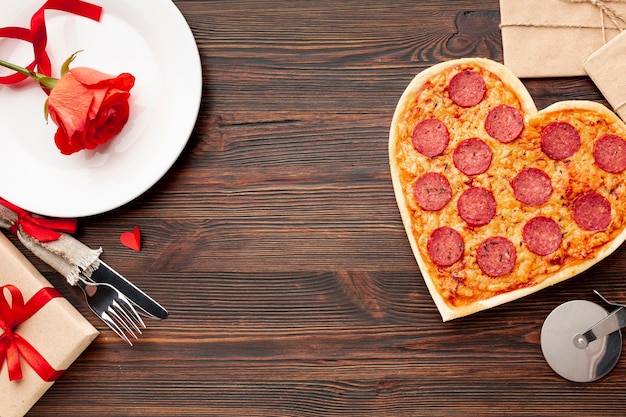 Lovely arrangement for valentines day dinner with heart shaped pizza