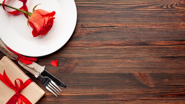 Lovely arrangement for valentines day dinner on wooden background with copy space