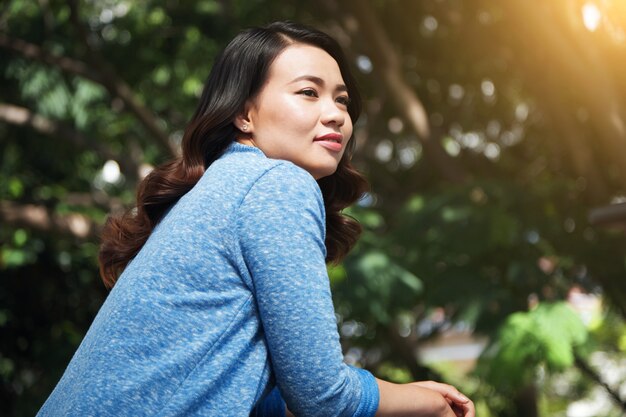 Lovely Asian woman in park