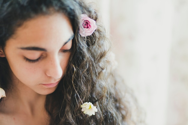 Free Photo lovely brunette with flowers in hair