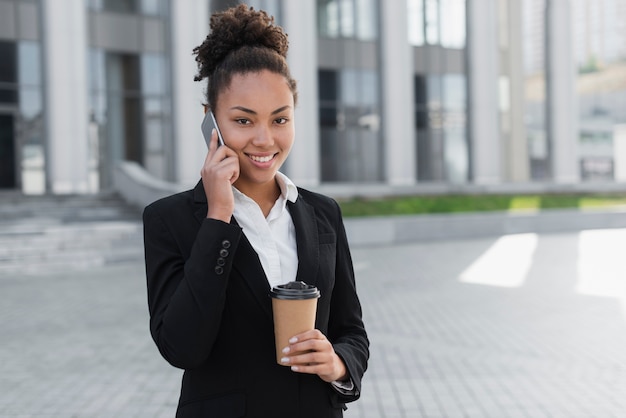 Lovely business woman talking on phone