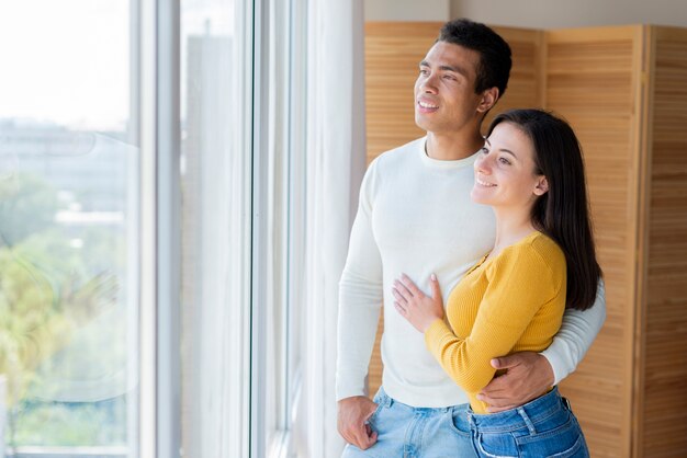 Lovely couple looking out the window