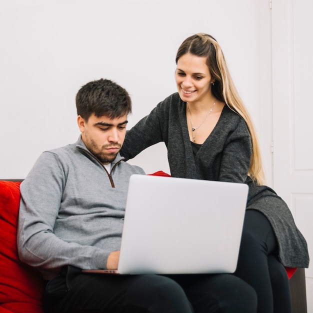 Lovely couple using laptop