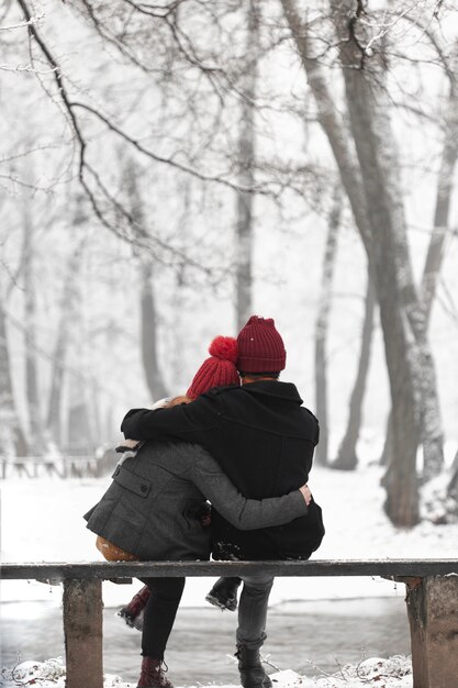 Lovely couple warming each other with a hug