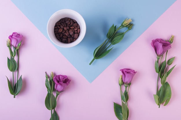 Free photo lovely flowers concept with coffee beans