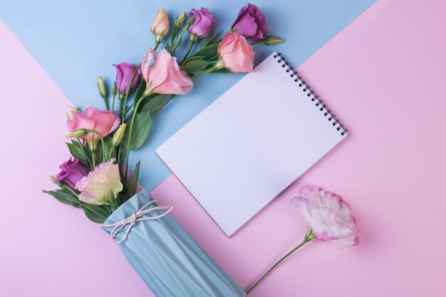 Lovely flowers concept with modern notebook