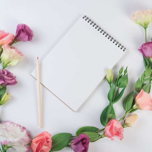 Lovely flowers concept with modern notebook