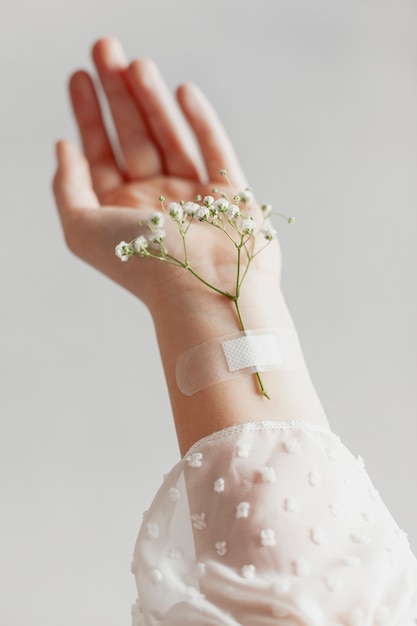 Lovely flowers taped on hand