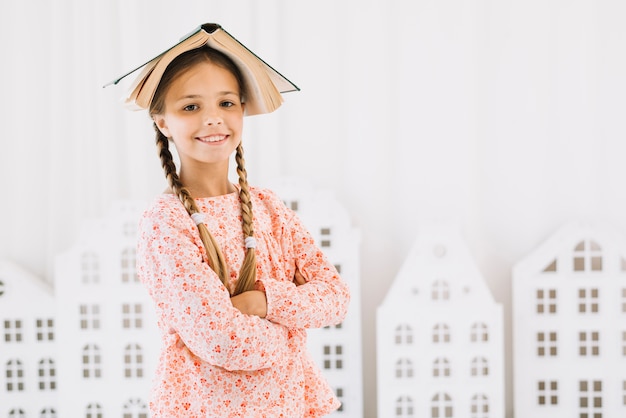 Free photo lovely happy girl posing with a book