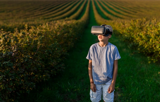 Lovely little boy having fun with virtual reality glasses