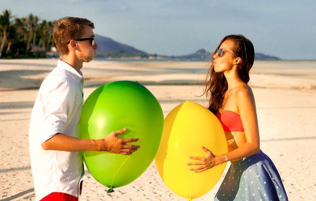 Lovely Portrait of two happy young people dating and having fun on the beach