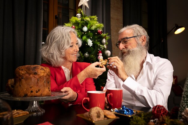 Lovely senior couple having christmas cookies