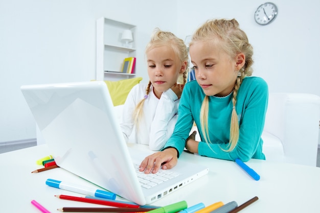 Lovely twins studying together