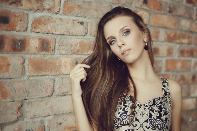 Lovely woman posing with elegant black dress, fashion concept