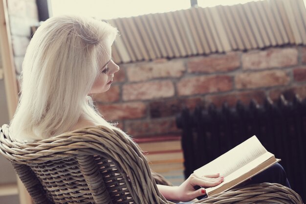 Lovely woman reading a book