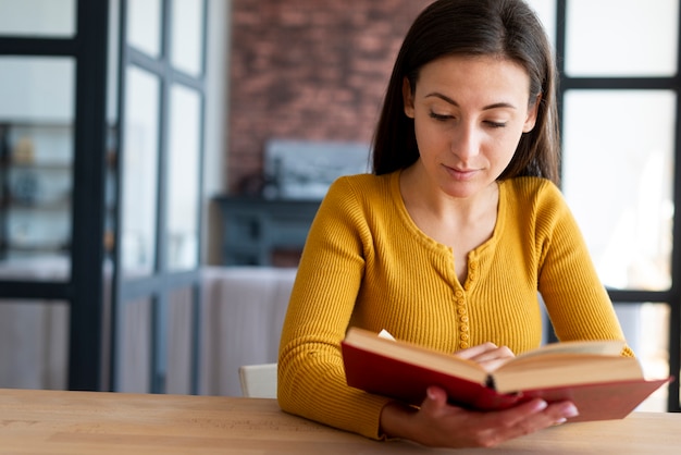 Lovely woman reading a book