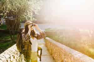 Free photo lovely woman using binoculars