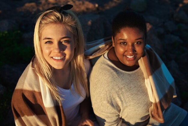 Lovely women under blanket on party