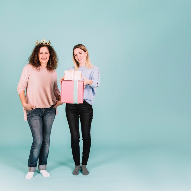 Lovely women with crown and gifts