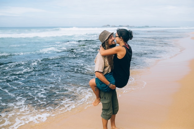 Lovers having fun on the seashore