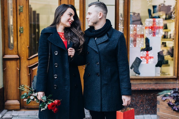 Loving couple on date posing at street