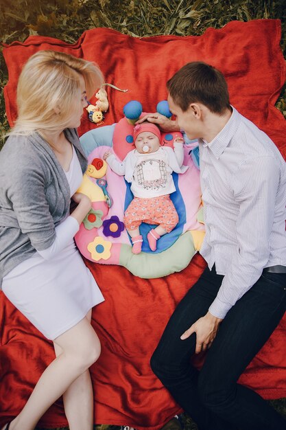 Loving couple lying on their baby's side