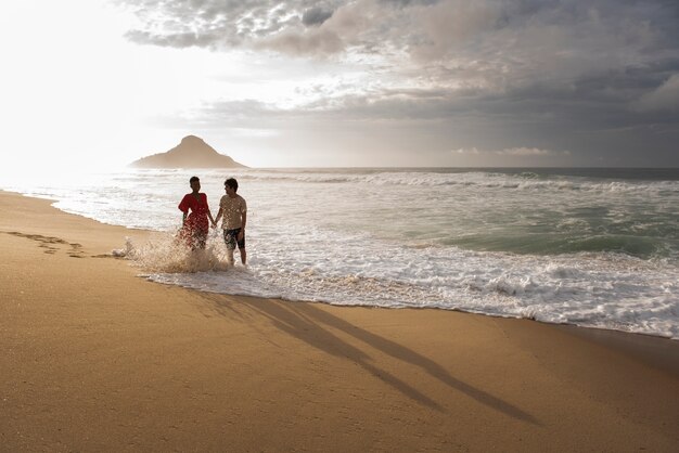 Loving couple showing affection on the beach near the ocean