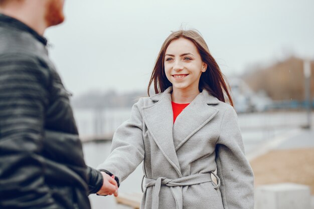 Loving couple walking around the river.