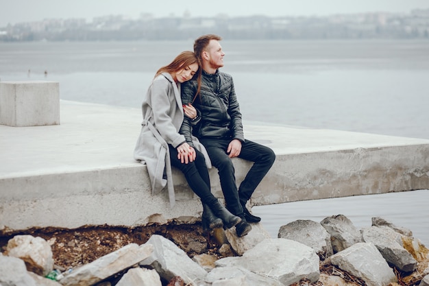 Loving couple walking around the river.