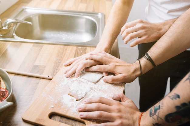 Free photo loving gay couple cooking together