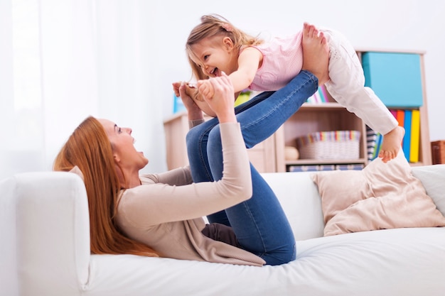 Loving mother and daughter have fun together