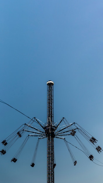 Free photo low angle arrangement with carnival ride