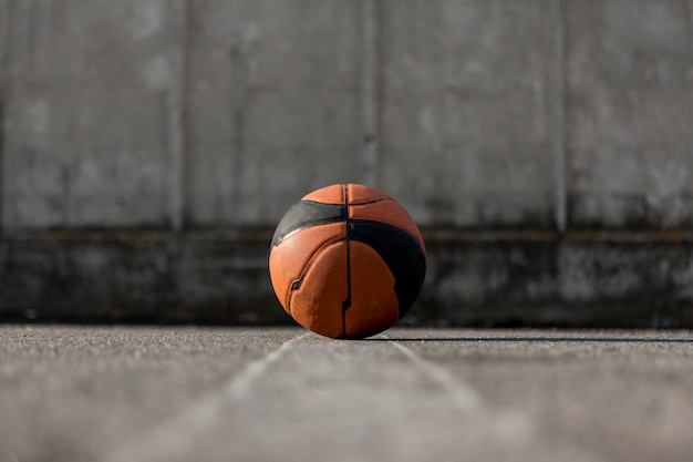 Free photo low angle basketball on asphalt