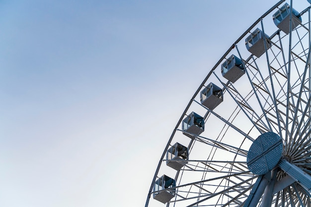 Free Photo low angle of big ferry wheel in the city with copy space